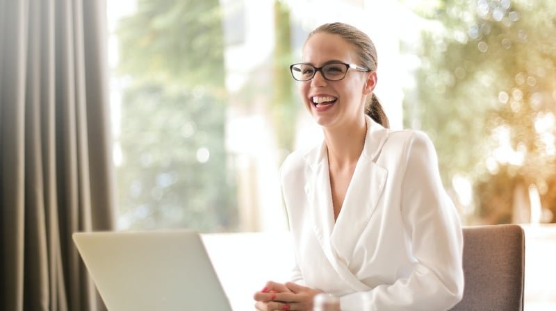 woman-smiling-over-laptop-guide-to-career-change