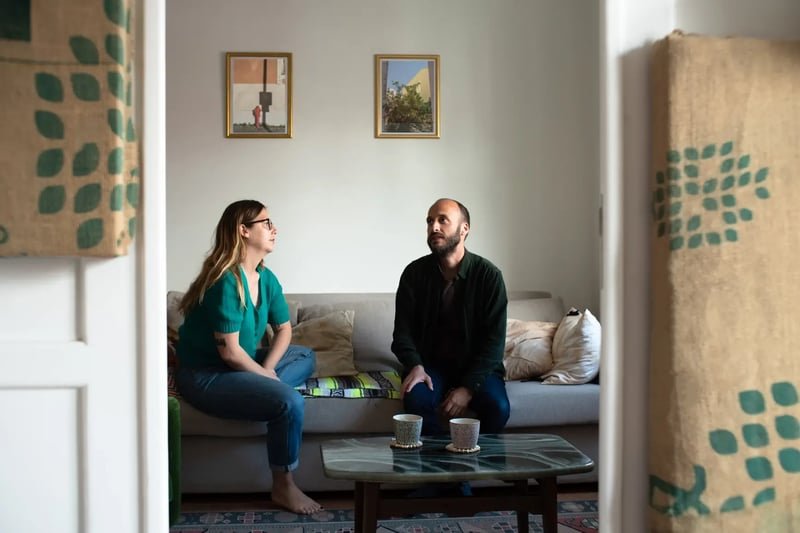 Couple-Talking-In-The-Living-Room