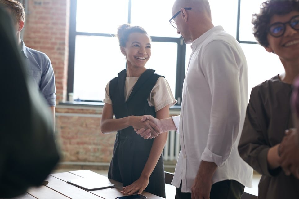 Young-woman-shaking-hand-of-employer-after-interview-how-to-get-a-job-with-no-experience